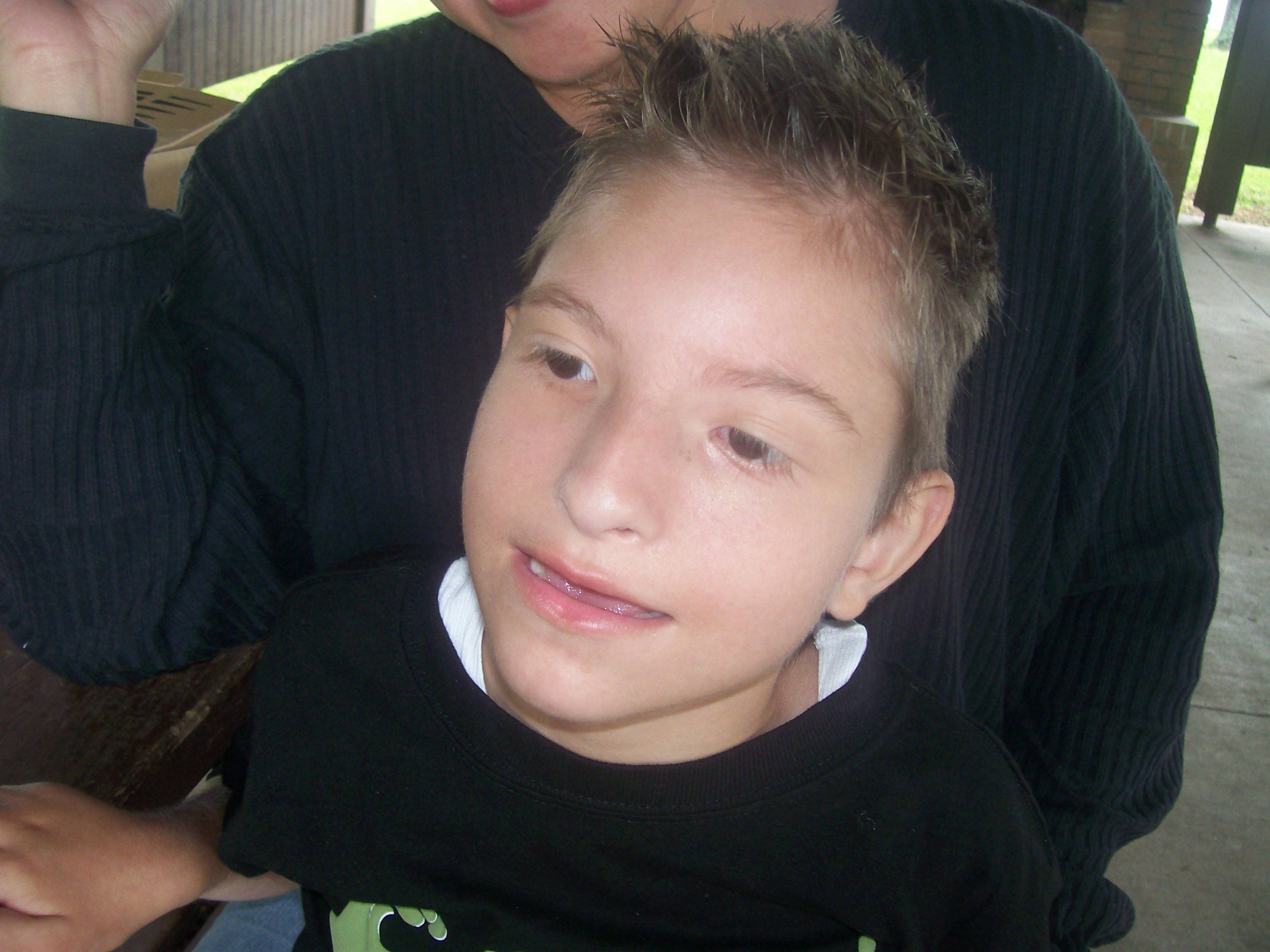 He was the happiest little guy, though. He would laugh and giggle at anything. He loved music, and water, to be held and snuggled, and twirled around. He liked to be treated like a BOY, not like a fragile baby- and he WASN'T sick, or fragile- there were just some common sense things that we had to pay attention to. He never, EVER cried, unless he was faking it to get more snacks. :)