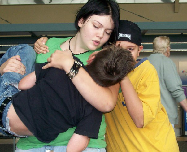 After almost 4 years of caring for them, I reached a point where I could no longer, emotionally or financially do it anymore. Our father was sending money, but I still had to work. Finding affordable daycare for the two of them was next to impossible, and Cameron was reaching the age where he needed his Daddy. So I asked our father to return to the States and get them. This is me telling them goodbye at the airport. Sometimes I feel like this was the last day that I was alive