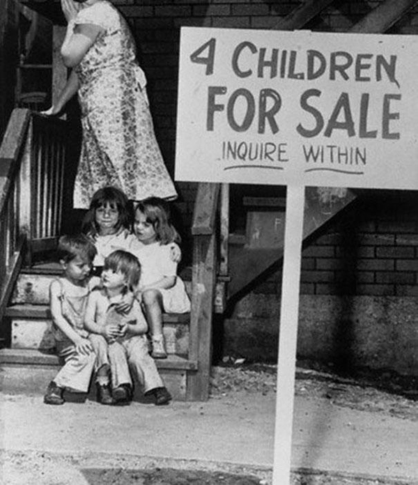 29.) A mother shamefully hides her face after listing her children for sale in 1948.