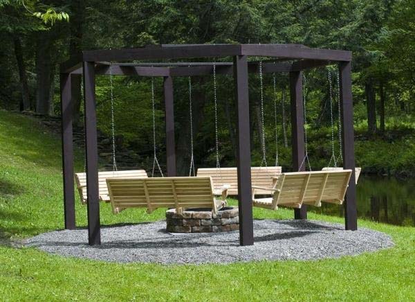 18.) Fire pits are awesome... but fire pits with swings? Even better.