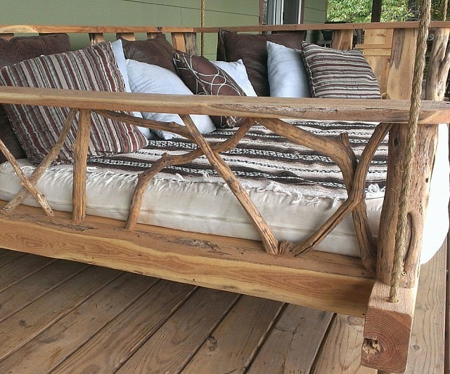 17. Take a nap on a cozy porch swing bed.