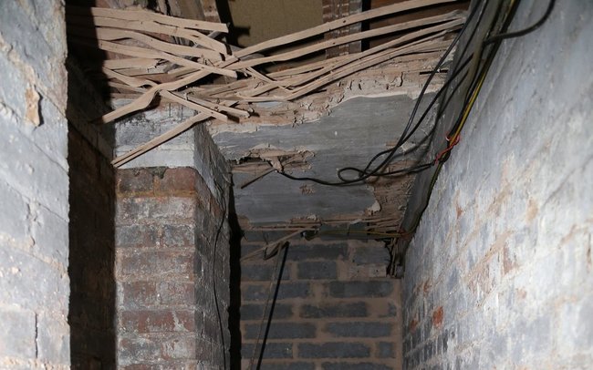 A possible secret room in between apartments (in the ceiling of the corridor).