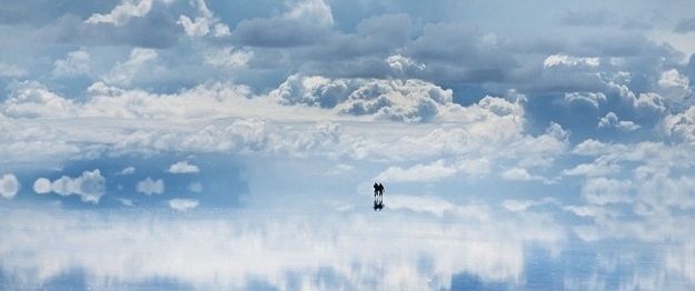 22. This isn't what an artist thinks heaven looks like: actually, it's a giant salt flat in Bolivia. The surface reflects and looks like a giant mirror.