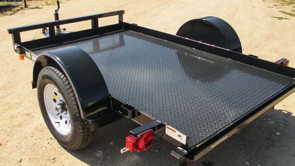 He began by purchasing a small trailer.