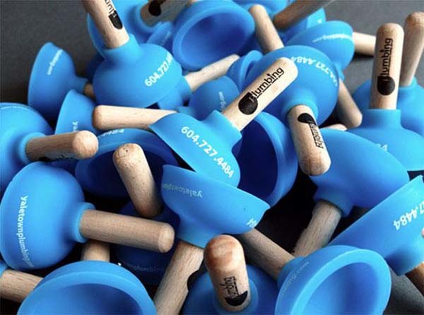 2.) Mini plungers, complete with the plumber's contact information.