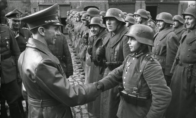 Joseph Goebbels and a young German recruit in 1945.