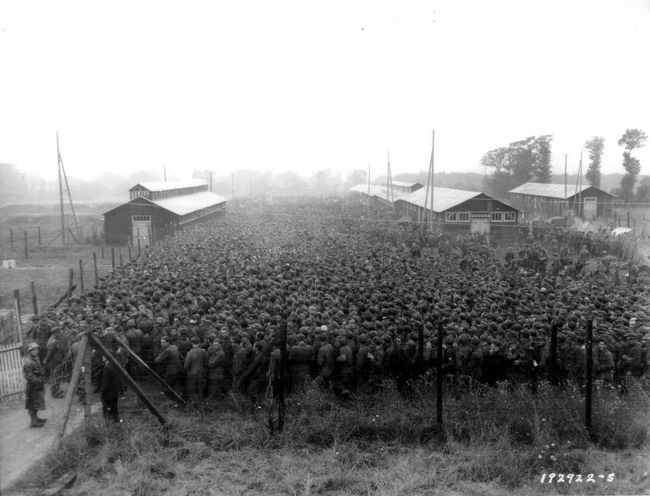 German prisoners packed into a prison camp.