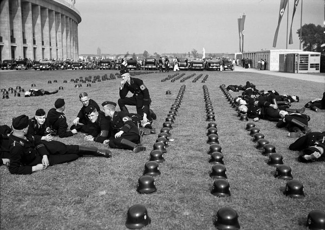 Nazi SS troops lounging outside of the Olympic Games in Berlin, 1936.