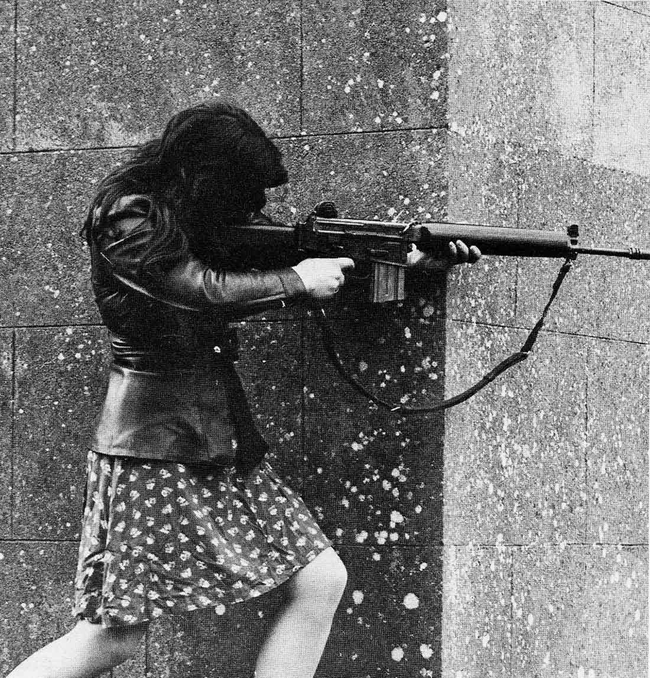 Female IRA fighter showing off her assault rifle in the 1970s.