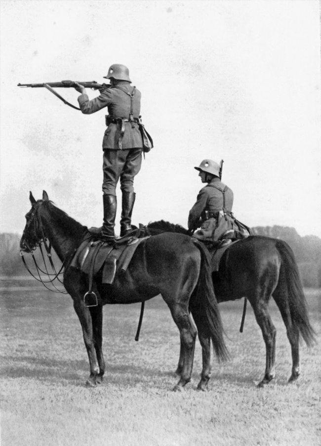 A German soldier balancing on a trained horse in 1935.