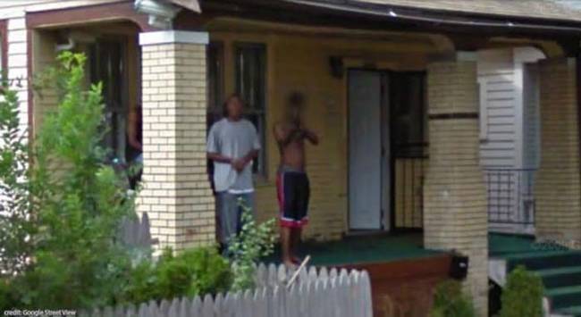 Just a guy pointing a shotgun at the Google Street View van.