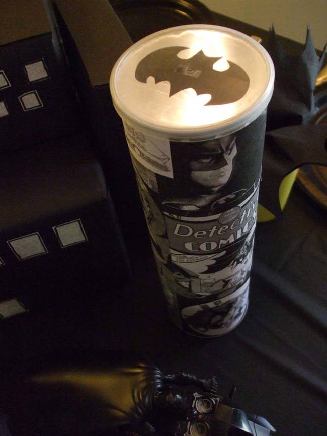 Make a bat signal out of a Pringles can and a flashlight. Check out the tutorial here.