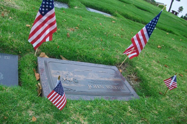 World famous actor John Wayne is not buried in Los Angeles where you might expect, but in a modest gravesite by Newport Beach.