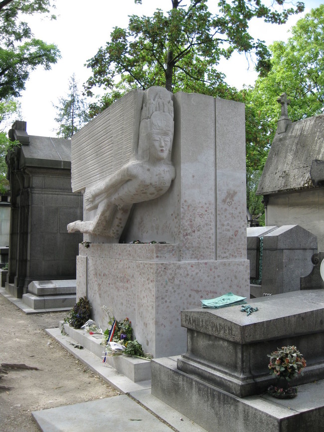 This is Oscar Wilde's tomb in Paris, although Wilde himself only took out a temporary lease on it. It seems he asked that his body be encased in quicklime so it would decompose faster.