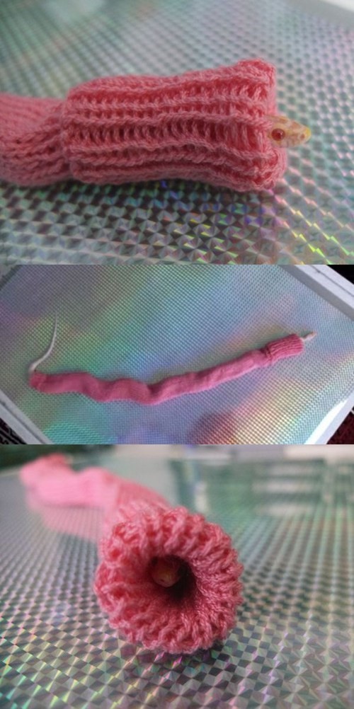 ...She's wearing a giant pink turtleneck.