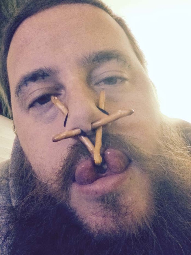 I'm pretty sure those are pretzels inside his nose piercings.