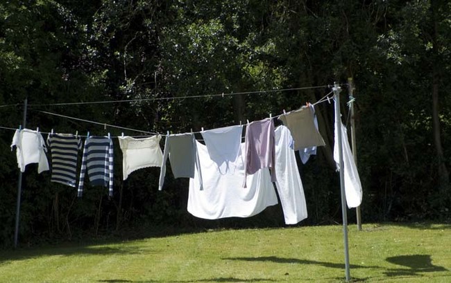 If you put sweaters on a line or a hanger to dry, they're more likely to stretch out. Lay them on a flat surface instead.