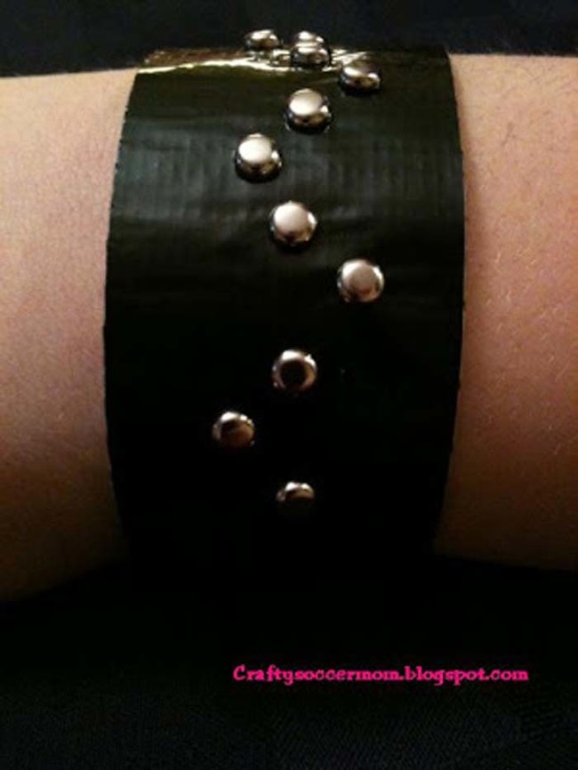 Craft a trendy bracelet using duct tape and silver studs.