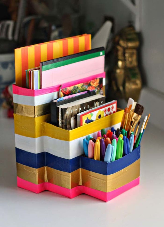 Cover cardboard boxes with duct tape to make a chic desk organizer.