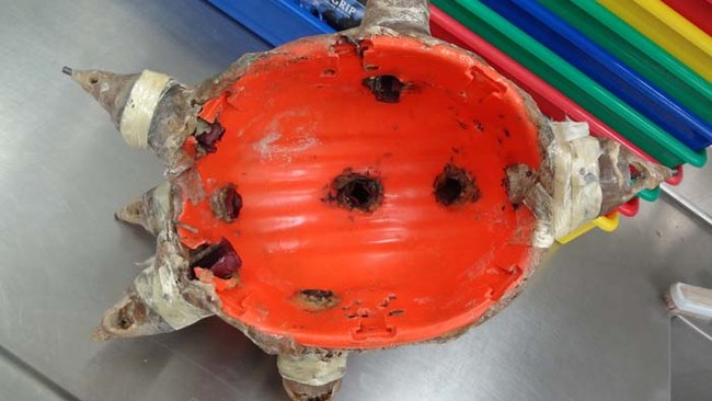 The inside of the helmet. You can see the holes where the shells fired.