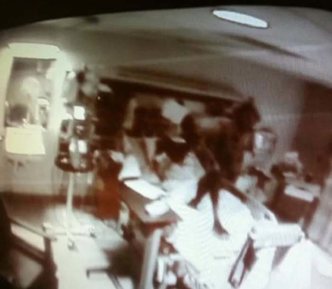 Hospital cameras caught some sort of dark spirit looming over a patient one night. The patient died a few hours later.