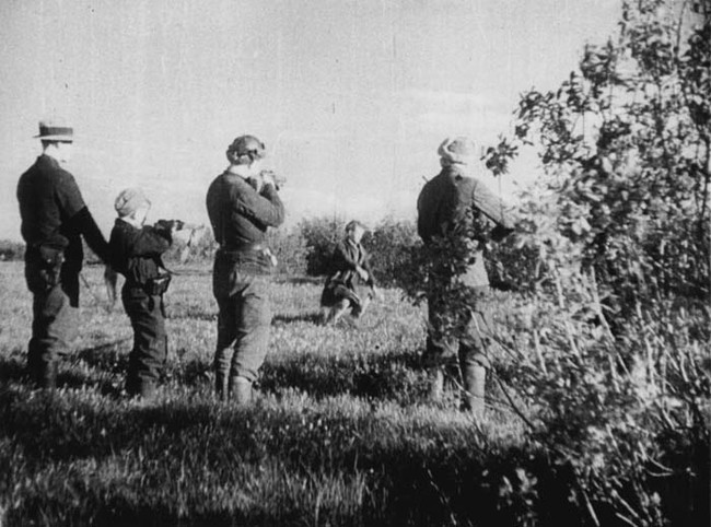 Soviet guerrillas executing a traitor behind German lines in 1944.