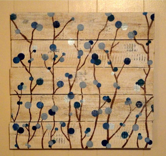 Use slats of wood glued together as a canvas for artwork.