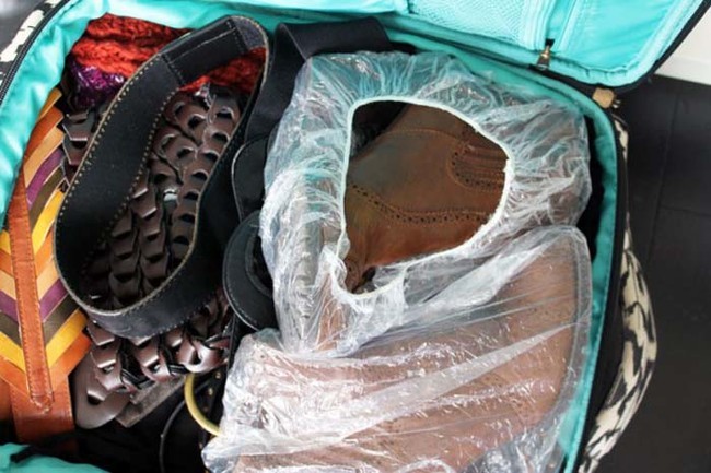 Use shower caps to keep your shoes separate from your clothes in a suitcase.