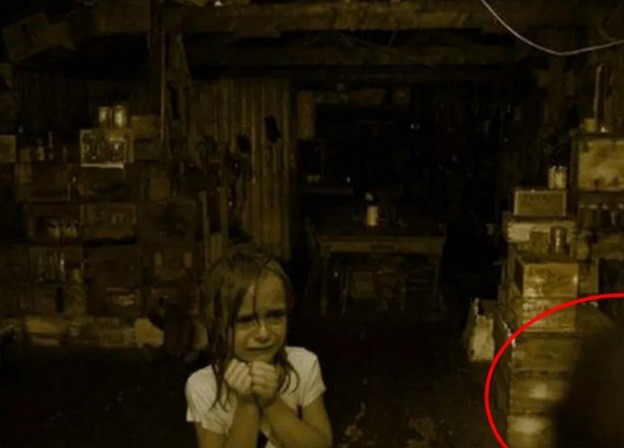 Whatever this girl is afraid of, you can see its shadow in the corner.