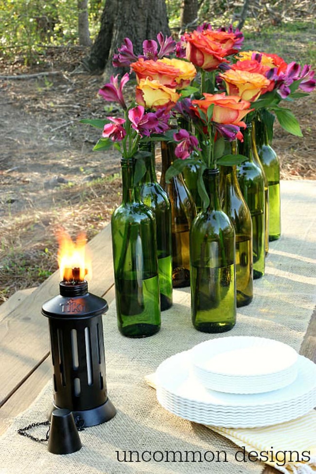 Use wine bottles as vases for gorgeous flower arrangements.