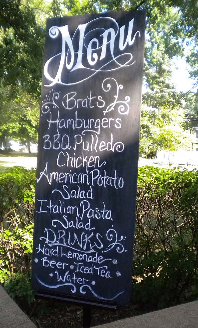 A massive chalkboard menu is a great way to inform your guests of the food choices. 
