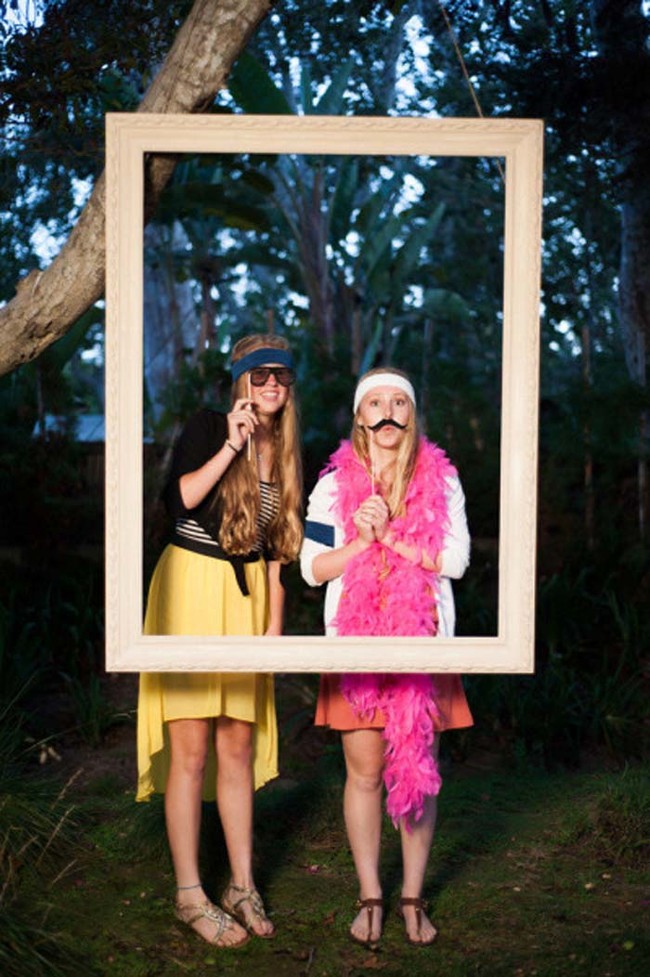 Hang a giant picture frame from a high tree and make a fun photo booth.