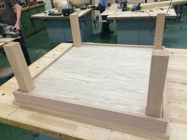 Next, he attached the legs.