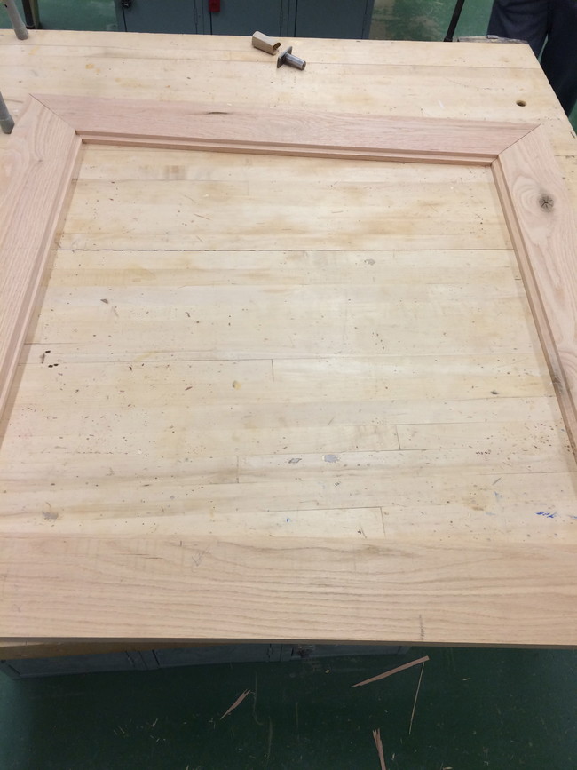 He started by putting together the top of the table.