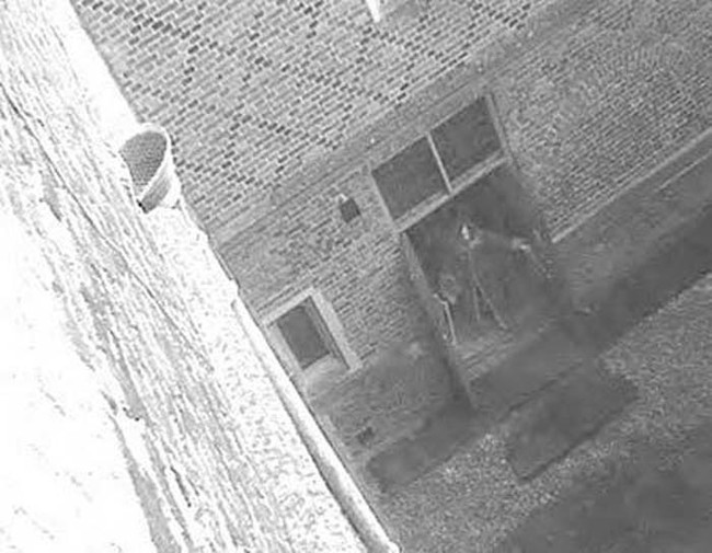 This supposed picture of the Hampton Court Ghost might look convincing, but is clearly fake. If you look closely, you can see that the ghost is wearing sneakers.