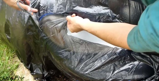 Before you apply the clear coat to your headlights, cover your car in garbage bags to prevent the spray from getting on your paint job. Use the scissors to cut around the headlight.