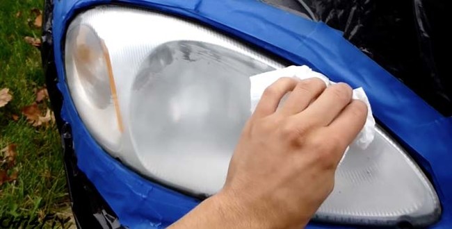 Wipe the headlight down once again with rubbing alcohol. Give it five minutes to dry.