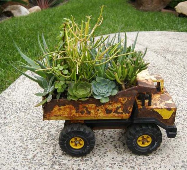 You can also plant greenery in old kids' toys.