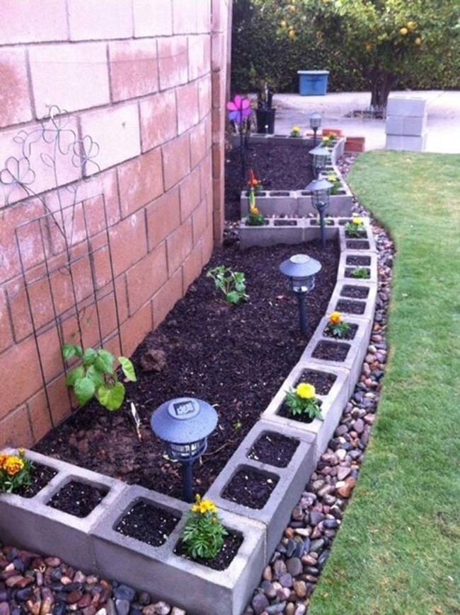 Cinder blocks make for a great garden wall, and you can plant even more things inside of them.
