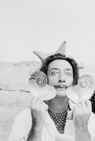 Salvador Dali embracing the weirdness we have all felt at one time or another.