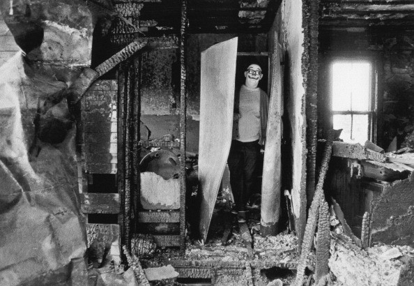 A clown in a burnt-out house, USA, 1975. Welcome to my nightmare.