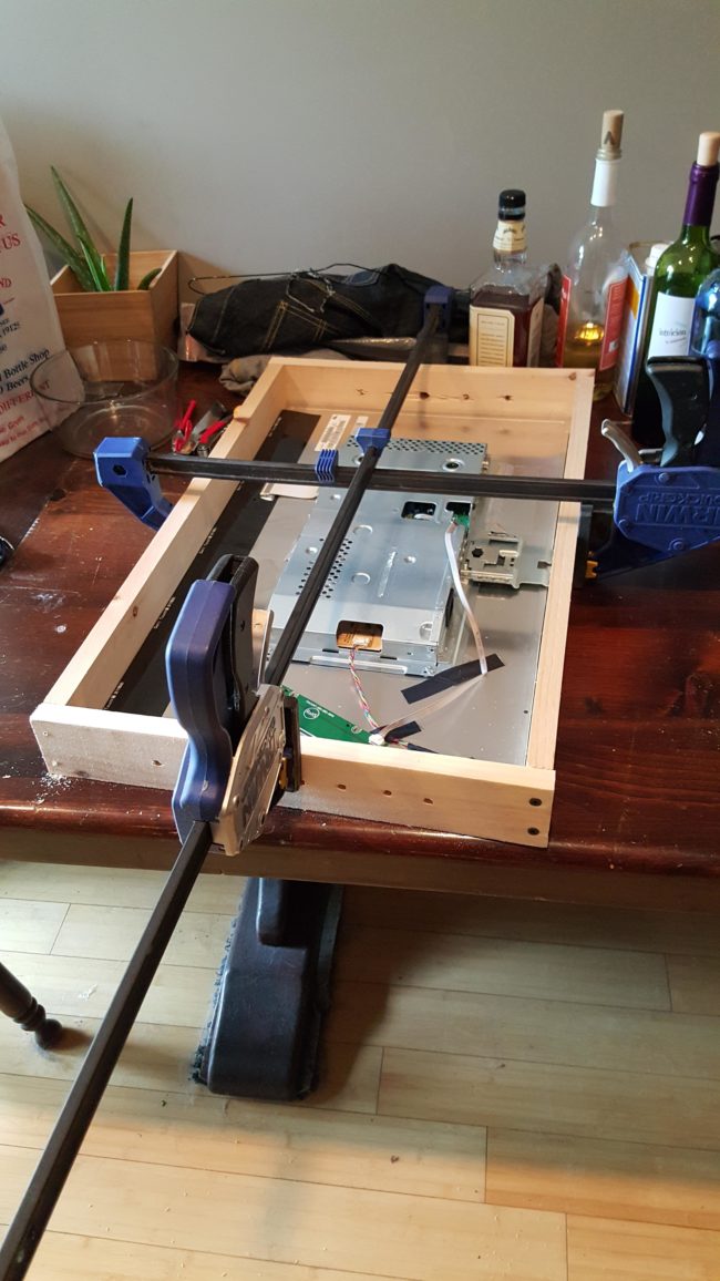 He started building a completely new case to surround the mirror.