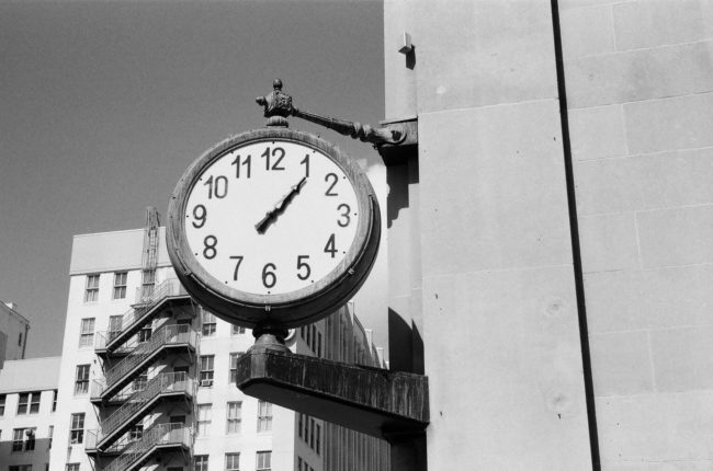 Draw a clock face from memory that's set to 3:40 with accurate number placement.