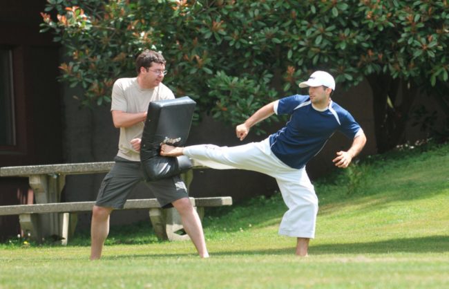 You'll burn some calories while training in martial arts. You will run, jump, lift, and generally kick your own butt into shape.