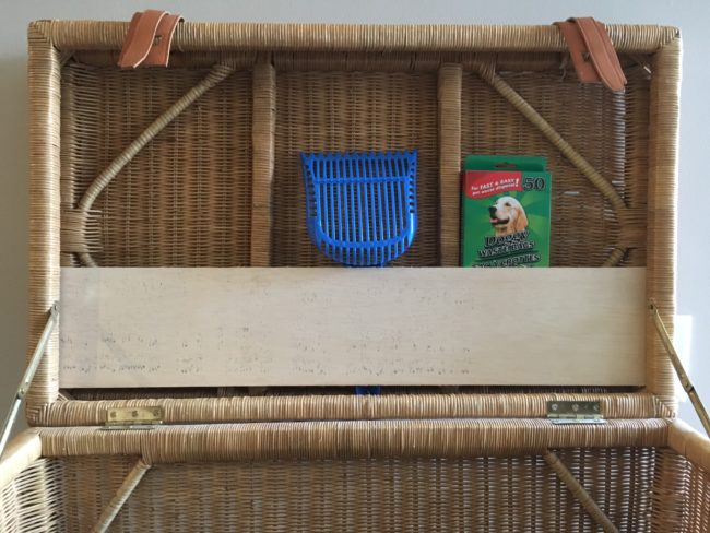After finishing the floor, he cut another strip of plywood that was the width of the lid to make a shelf. That way he could store everything he'd need when cleanup time rolled around.