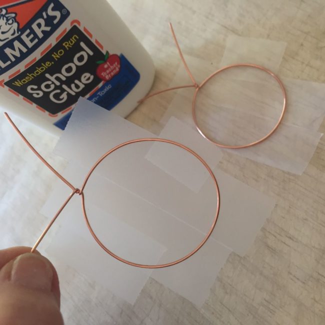 Then stick the shape on some tape. Press down firmly here!