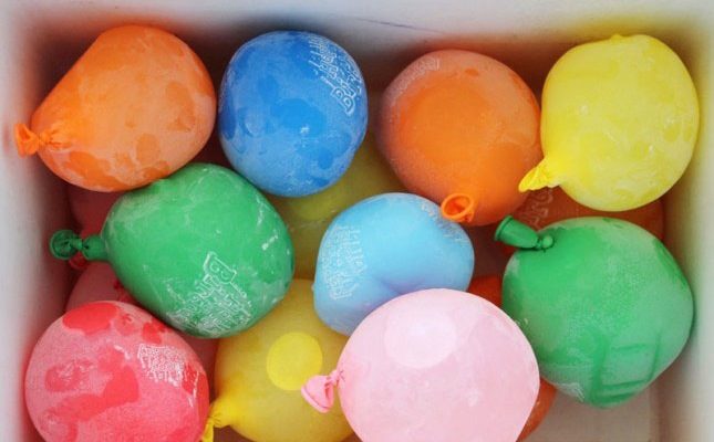 You know who wants to buy 30,000 ice packs or deal with melting ice cubes? No one. You know who wants to peg their guests with water balloons? Everyone. Make ice packs out of balloons, and when they melt...well...you know what to do.