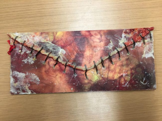 This is an invitation to a Halloween party that someone received in the mail.