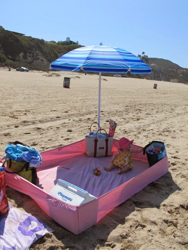 You can also use a fitted sheet at the beach to create a sand-free zone.