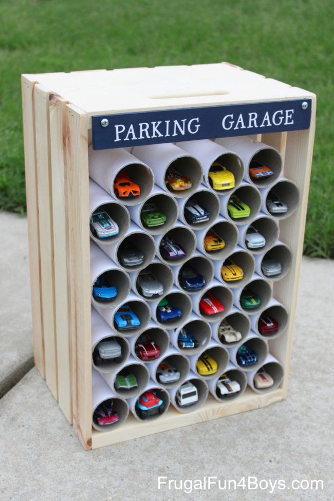 An old crate filled with empty toilet paper tubes makes an ideal parking garage for toy cars.